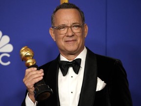 Tom Hanks poses backstage with his Cecil B. DeMille award at the 77th Golden Globe Awards in Beverly Hills, California, U.S. on  January 5, 2020.