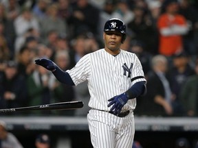 New York Yankees designated hitter Edwin Encarnacion walks to load the bases against the Houston Astros during the first inning in game four of the 2019 ALCS playoff baseball series at Yankee Stadium.