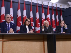 B'nai Brith CEO Michael Mostyn, right to left, and B'nai Brith Senior Legal Counsel David Matas are joined by Iranian-Canadian community leaders Avideh Motmaen-Far and Reza Banai as they hold a press conference at the National Press Theatre in Ottawa on Monday, Jan. 13, 2020.