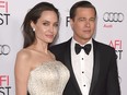 In this Nov. 5, 2015, file photo, Angelina Jolie (L) and Brad Pitt attend the opening night gala premiere of Universal Pictures' "By the Sea," during AFI FEST 2015 presented by Audi at TCL Chinese 6 Theatres on  in Hollywood, Calif.