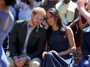 Britain's Prince Harry and his wife Meghan, Duchess of Sussex, watch a performance during their visit to Macarthur Girls High School in Sydney, Australia October 19, 2018.