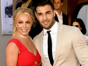 Britney Spears (L) and Sam Asghari arrive at the premiere of Sony Pictures' "One Upon A Time...In Hollywood" at the Chinese Theatre on July 22, 2019 in Hollywood, Calif.