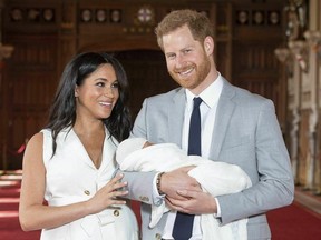 In this Wednesday May 8, 2019 file photo, Britain's Prince Harry and Meghan, Duchess of Sussex, during a photocall with their newborn son, in St. George's Hall at Windsor Castle, England. (THE CANADIAN PRESS/Dominic Lipinski/Pool via AP, file)