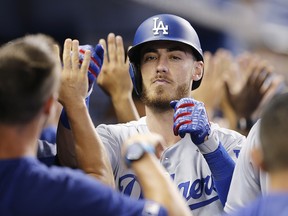 Cody Bellinger of the Los Angeles Dodgers celebrates with teammates after hitting a three-run home run against the Miami Marlins at Marlins Park on August 15, 2019 in Miami. (Michael Reaves/Getty Images)