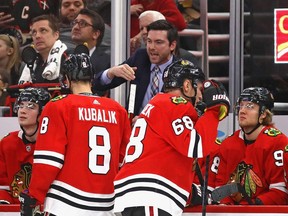 Chicago Blackhawks head coach Jeremy Colliton gives instructions to his team during a game in late December.