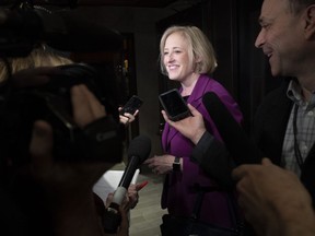 Former Conservative MP Lisa Raitt speaks with the media as she arrives for a Conservative caucus meeting on Parliament hill in Ottawa, Wednesday November 6, 2019. The Conservatives will choose their next leader at a convention on June 27 in Toronto.