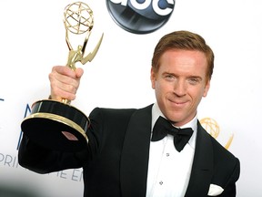 Actor Damian Lewis, winner of the Outstanding Lead Actor In A Drama Series award for "Homeland," poses backstage at the 64th Primetime Emmy Awards at the Nokia Theatre on Sunday, Sept. 23, 2012, in Los Angeles.