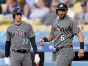 David Peralta of the Arizona Diamondbacks reacts in front of Jake Lamb during the first inning at Dodger Stadium on July 2, 2019 in Los Angeles. (Harry How/Getty Images)