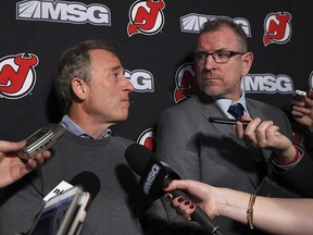 New Jersey Devils owner Joshua Harris (left) answers questions from the media after announcing that Tom Fitzgerald (right) has taken over general manager duties prior to a game against the Tampa Bay Lightning at Prudential Center on January 12, 2020 in Newark. (Jim McIsaac/Getty Images)