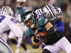 Jaylon Smith of the Dallas Cowboys tackles Zach Ertz of the Philadelphia Eagles during the second half in the game at Lincoln Financial Field on Dec. 22, 2019 in Philadelphia, Pa.