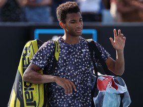 Canada's Felix Auger-Aliassime leaves the court after losing to Ernests Gulbis during their match at the Australian Open in Melbourne on January 21, 2020. (DAVID GRAY/AFP via Getty Images)