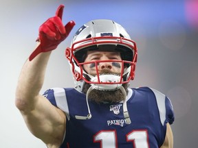 New England Patriots wide receiver Julian Edelman points to the crowd before a game against the Tennessee Titans at Gillette Stadium.