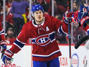 Brendan Gallagher of the Montreal Canadiens celebrates with his teammates after scoring against the Calgary Flames at Scotiabank Saddledome on December 19, 2019 in Calgary. (Derek Leung/Getty Images)