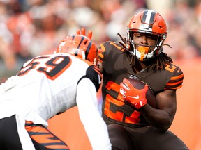 Cleveland Browns' Kareem Hunt, right, attempts to run the ball past Nick Vigil of the Cincinnati Bengals during the first quarter at FirstEnergy Stadium on Dec. 8, 2019 in Cleveland, Ohio. (Kirk Irwin/Getty Images)