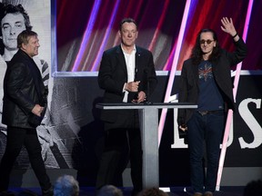 Rock and Roll Hall of Fame inductees (from left to right) Alex Lifeson, Neil Peart and Geddy Lee of Rush speak onstage at the 28th Annual Rock and Roll Hall of Fame induction ceremony at Nokia Theatre L.A. Live on April 18, 2013 in Los Angeles, Calif.  (Kevin Winter/Getty Images)