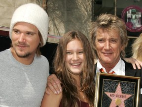 In this Oct. 11, 2005 file photo, singer Rod Stewart, right, is pictured with his children Sean, left, and Renee at a ceremony honouring Stewart with a star on the Hollywood Walk of Fame in Hollywood, California.  (Vince Bucci/Getty Images)