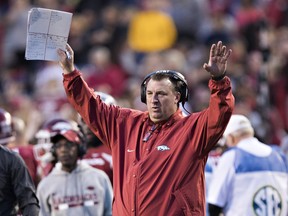 Head Coach Bret Bielema of the Arkansas Razorbacks signals to the officials during a game against the Missouri Tigers at Razorback Stadium on November 24, 2017 in Fayetteville, Arkansas.