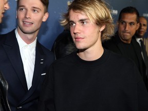 Patrick Schwarzenegger and Justin Bieber attend Global Road Entertainment's world premiere of "Midnight Sun" at ArcLight Hollywood on March 15, 2018 in Hollywood, California.