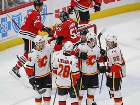 Calgary Flames centre Elias Lindholm celebrates with teammates after scoring against the Chicago Blackhawks during the second period at United Center on Jan 7, 2020, in Chicago.