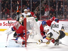 Vegas Golden Knights' William Carrier shoots the puck against Canadiens goaltender Carey Price as Nate Thompson defends at Bell Centre in Montreal on Saturday, Jan. 18, 2020.