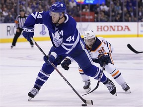 Toronto Maple Leafs defenceman Morgan Rielly goes to shoot the puck as Edmonton Oilers forward Kailer Yamamoto defends at Scotiabank Arena on Jan. 6, 2020.