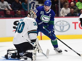 San Jose Sharks goaltender Aaron Dell (30) blocks a shot on net by Vancouver Canucks forward Bo Horvat (53) during the first period at Rogers Arena.