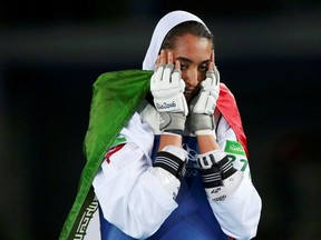Kimia Alizadeh Zenoorin (IRI) of Iran celebrates.
