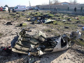 Debris of a plane belonging to Ukraine International Airlines, that crashed after taking off from Iran's Imam Khomeini airport, is seen on the outskirts of Tehran, Iran, on Wednesday, Jan. 8, 2020.