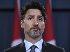 Prime Minister Justin Trudeau speaks during a press conference in Ottawa on Saturday, Jan. 11, 2020. Trudeau says Iran must take full responsibility for mistakenly shooting down a Ukrainian jetliner, killing all 176 civilians on board, including 57 Canadians.
