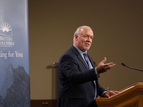 B.C. Premier John Horgan holds his first press conference of the year as he comments on various questions from the media in the Press Gallery at B.C. Legislature in Victoria, B.C., on Monday, Jan. 13, 2020.