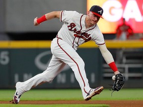 Josh Donaldson of the Atlanta Braves fails to come up with this single hit by Bryce Harper of the Philadelphia Phillies at SunTrust Park on September 17, 2019 in Atlanta. (Kevin C. Cox/Getty Images)