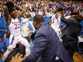 Silvio De Sousa of the Kansas Jayhawks picks up a chair during a brawl against the Kansas State Wildcats at Allen Fieldhouse on January 21, 2020 in Lawrence, Kansas. (Jamie Squire/Getty Images)