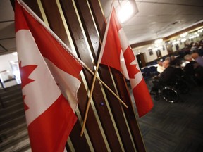 Canadian flags are displayed at the Royal Canadian Legion, St. James Branch No. 4 in Winnipeg, Thursday, November 8, 2018. (THE CANADIAN PRESS/John Woods)