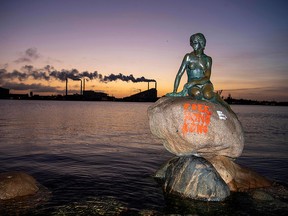 "Free Hong Kong" is written on the base of the Little Mermaid statue in Copenhagen after it has been exposed to vandalism early Monday, January 13, 2020. (THOMAS SJOERUP/Ritzau Scanpix/AFP via Getty Images)