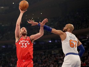 Raptors’ Marc Gasol (left) takes a shot as Knicks’ Taj Gibson defends on Friday night in New York. (GETTY IMAGES)