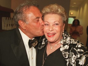 Marilyn Lastman is all smiles as Mel Lastman plants one on her cheek at the mayor’s award dinner in December 2005.