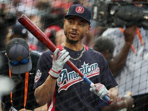 Mookie Betts of the Boston Red Sox warms up before the 89th MLB All-Star Game  at Nationals Park on July 17, 2018 in Washington. (Patrick Smith/Getty Images)
