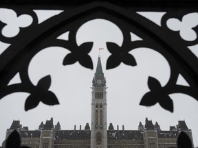 Freezing rain turns the Peace Tower white, Thursday Jan. 24, 2019 in Ottawa.