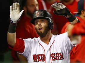 Dustin Pedroia #15 of the Boston Red Sox returns to the dugout after scoring in the third inning of a game against the Minnesota Twins at Fenway Park on June 27, 2017 in Boston, Massachusetts. (Photo by Adam Glanzman/Getty Images)