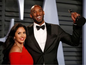 Kobe Bryant holds his Oscar for Best Animated Short, with wife Vanessa.