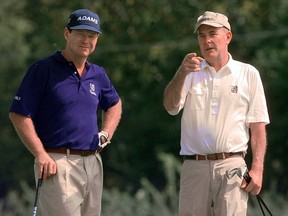 Tom Watson, left, gets some pointers from course designer Pete Dye as they wait to tee off on the par-3, 15th hole at the Brickyard Crossing golf course in Indianapolis Wednesday, Sept. 8, 1999.  (AP Photo/Michael Conroy)