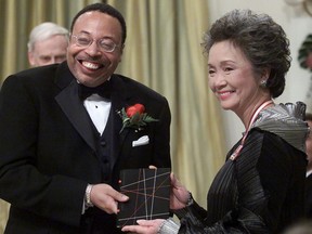 Adrienne Clarkson presents the Governor General's Literary Award for poetry to George Elliott Clarke during a ceremony at Rideau Hall in Ottawa, Wednesday, November 14, 2001.