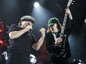 Brian Johnson, left, and Angus Young, right, of AC/DC perform at Commonwealth Stadium in Edmonton, Alta. on Sept. 20, 2015.