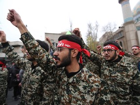 Iranian revolutionary guards take part in an anti-U.S. rally to protest the killings during an air strike of Iranian military commander Qasem Soleimani and Iraqi paramilitary chief Abu Mahdi al-Muhandis, in the capital Tehran on January 4, 2020. (ATTA KENARE/AFP via Getty Images)