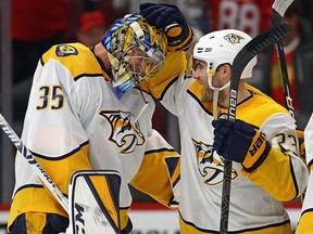 Pekka Rinne of the Nashville Predators celebrates a win against the Chicago Blackhawks and his first career goal with Rocco Grimaldi at the United Center on January 9, 2020 in Chicago.  (Jonathan Daniel/Getty Images)