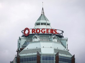 A sign is pictured on top of the Rogers Communications Inc. building on the day of their annual general meeting for shareholders in Toronto, April 21, 2015.