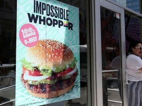 A sign advertising the soy based Impossible Whopper is seen outside a Burger King in New York, U.S., August 8, 2019.