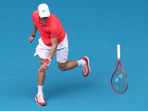 Denis Shapovalov throws his racquet during his first-round match against Marton Fucsovics at the 2020 Australian Open at Melbourne Park on January 20, 2020 in Melbourne. (Cameron Spencer/Getty Images)