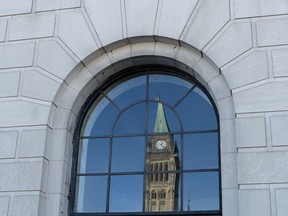 The Peace tower is reflected in a window in Ottawa, March 26, 2019. Changes to the government's signature student jobs program last year caused such confusion that it sparked a massive spike in incomplete applications that federal officials are hoping to avoid a repeat of this year.