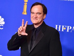 In this file photo taken on January 5, 2020 director Quentin Tarantino poses in the press room after winning the award for Best Screenplay - Motion Picture and Best Motion Picture - Musical or Comedy during the 77th annual Golden Globe Awards at The Beverly Hilton in Beverly Hills. (FREDERIC J. BROWN/AFP via Getty Images)